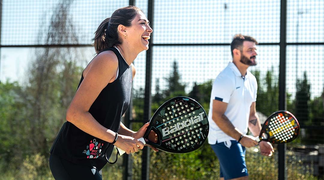 A woman and a man on a padel pista